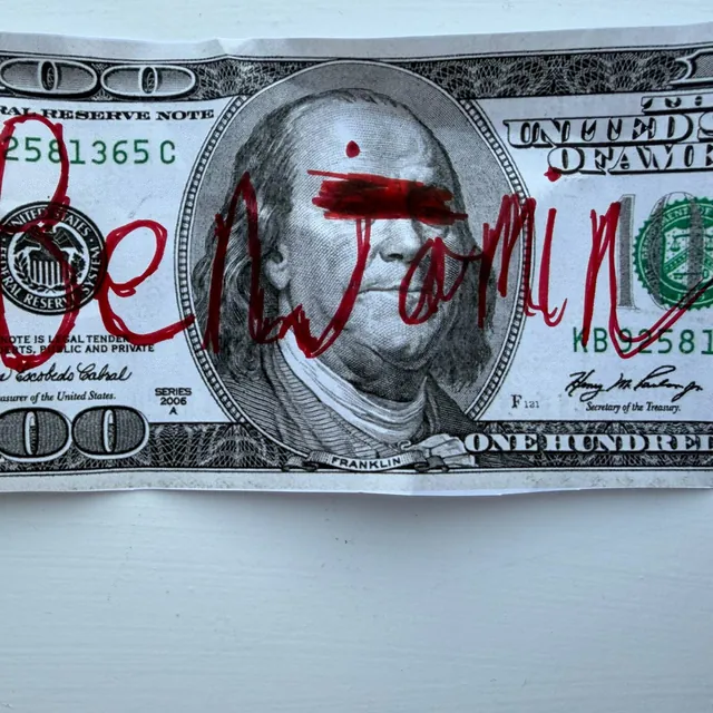 benjamin cover art: a $100 bill with benjamin scrawled across it in red marker, a red bar over the eyes